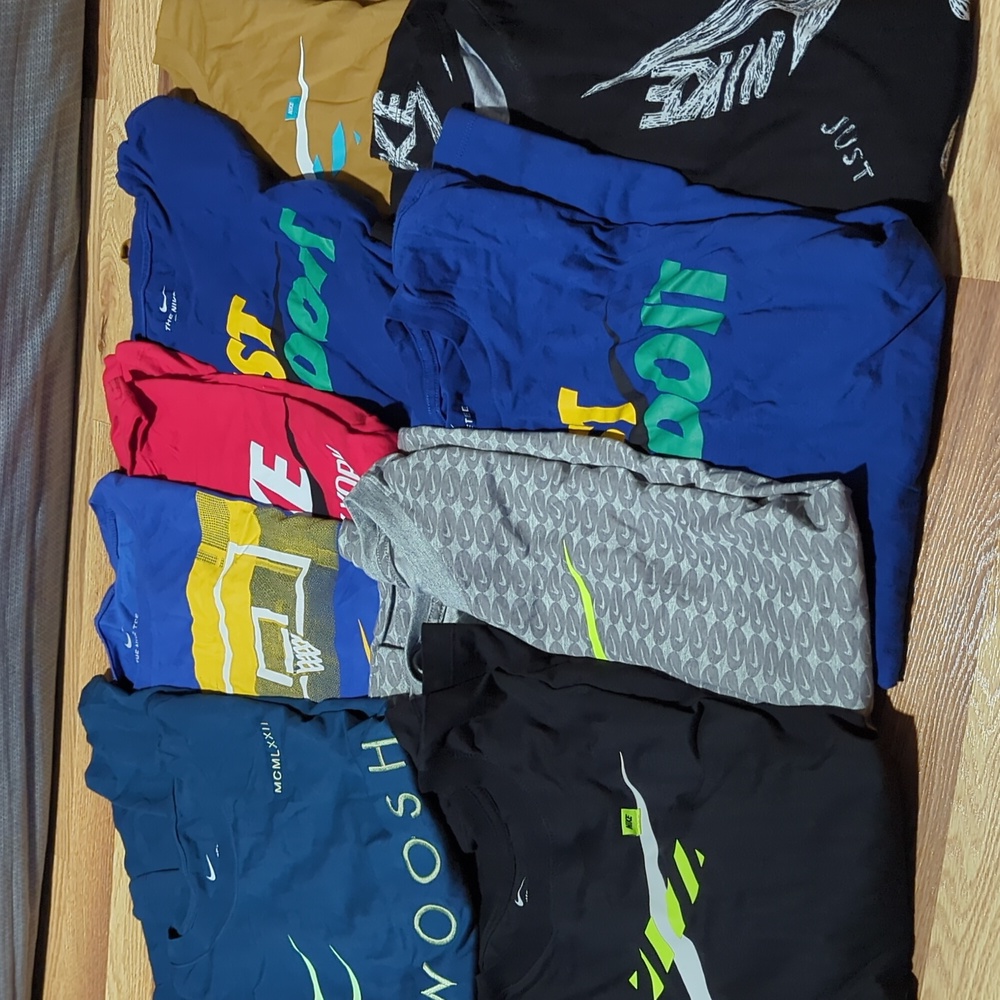 8 used Nike t-shirts. All size XL. Short sleeve shirts